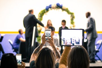 parents-with-mobile-devices-at-graduation-2023-11-27-05-19-01-utc-1.jpg