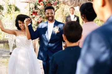 shot-of-a-happy-newlywed-young-couple-walking-down-2023-11-27-05-36-48-utc-1.jpg
